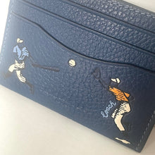 Load image into Gallery viewer, Blue textured wallet with golf-themed designs on a white background