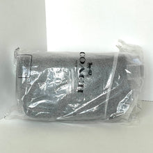 Load image into Gallery viewer, Coach pouch in clear plastic packaging on a white background