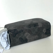 Load image into Gallery viewer, Black camouflage-patterned pillow on a white surface