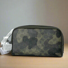 Load image into Gallery viewer, Camouflage-patterned toiletry bag on a white surface with a light gray background
