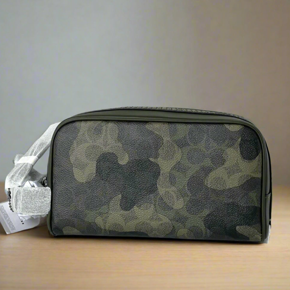 Camouflage-patterned toiletry bag on a white surface with a light gray background