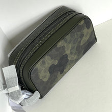 Load image into Gallery viewer, Camouflage-patterned toiletry bag with a white box on a light gray background