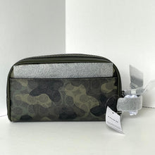Load image into Gallery viewer, Camouflage patterned toiletry bag with a silver interior on a white background