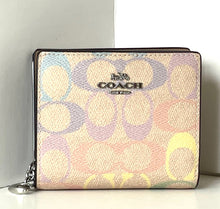 Load image into Gallery viewer, Coach wallet with multicolor logo pattern on a white surface