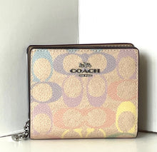 Load image into Gallery viewer, Coach wallet with multicolor logo pattern on a white background