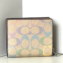 Load image into Gallery viewer, Patterned wallet with a chain detail on a light background