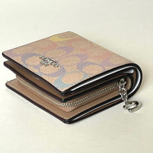 Load image into Gallery viewer, Designer wallet with chain detail on a light beige background