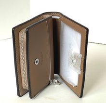 Load image into Gallery viewer, Open leather wallet with visible brand logo on a white background