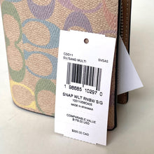 Load image into Gallery viewer, Product tag on a patterned wallet with visible text and numbers.