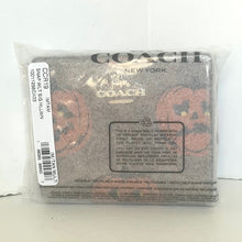 Load image into Gallery viewer, Coach wallet in packaging with visible branding on a white background