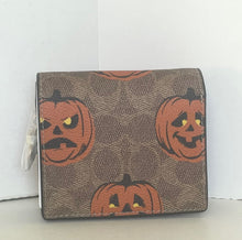 Load image into Gallery viewer, Wallet with pumpkin design on a white background