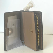 Load image into Gallery viewer, Open leather wallet with zipper on a white background