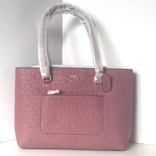 Load image into Gallery viewer, Pink handbag with white handles on a white background