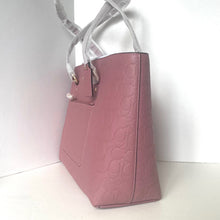Load image into Gallery viewer, Pink handbag with a visible brand logo on a white background