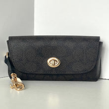 Load image into Gallery viewer, Black leather wallet with gold clasp on a white background