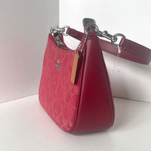 Load image into Gallery viewer, Red handbag with a visible brand logo on a light background