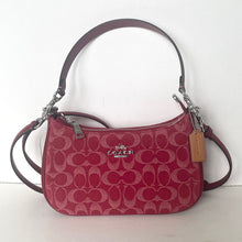 Load image into Gallery viewer, Red Coach handbag with a visible brand tag on a white background
