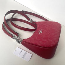 Load image into Gallery viewer, Red Coach handbag with a visible brand tag on a white background