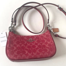 Load image into Gallery viewer, Red handbag with a visible brand logo on a white background