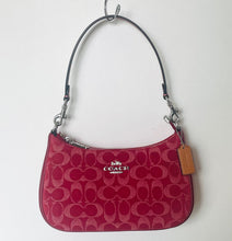 Load image into Gallery viewer, Red handbag with Coach logo on a white background
