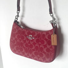 Load image into Gallery viewer, Red handbag with Coach logo on a white background