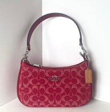 Load image into Gallery viewer, Pink handbag with a brand logo on a white background