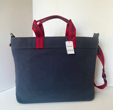 Load image into Gallery viewer, Navy blue bag with red handles on a white background