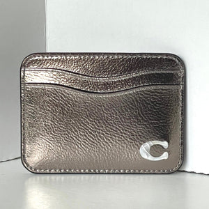 Metallic cardholder with a brand logo on a white background
