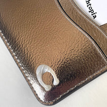 Load image into Gallery viewer, Close-up of a brown leather wallet with a white card holder on a light gray background