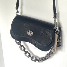 Load image into Gallery viewer, Black handbag with a chain strap on a white background