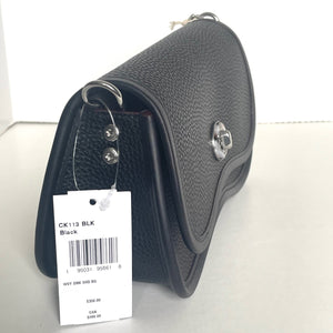 Black leather saddle pad with a tag on a white background