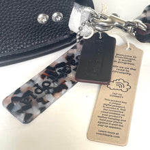 Load image into Gallery viewer, Coachtopia keychain with digital passport and tag on a white background
