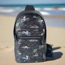 Load image into Gallery viewer, Black backpack with a tropical pattern on a white background