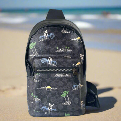 Black backpack with a tropical pattern on a white background