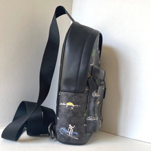 Load image into Gallery viewer, Black backpack with nature-themed design on a white background