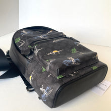 Load image into Gallery viewer, Black backpack with nature-themed design on a white surface
