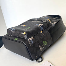 Load image into Gallery viewer, Black bag with nature-themed design on a white background