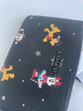 Load image into Gallery viewer, Coach X Disney Corner Zip Wristlet Holiday Black Minnie Mickey Daffy Pluto CN031