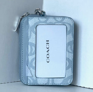 Coach wallet with floral pattern on a white background