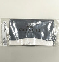 Load image into Gallery viewer, Coach wallet in packaging on a light gray background