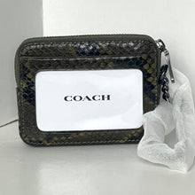 Load image into Gallery viewer, Coach wallet with a clear bag on a white background