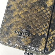 Load image into Gallery viewer, Coach wallet with snake skin pattern on a white background