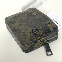 Load image into Gallery viewer, Snake skin patterned wallet with Coach logo on a white background