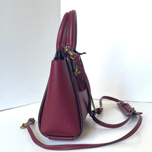 Load image into Gallery viewer, Maroon handbag with gold zipper on a white background