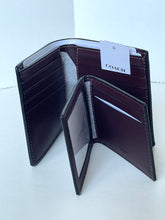 Load image into Gallery viewer, An open Coach bifold wallet in dark burgundy leather, showing multiple card slots, a white interior lining, and a white COACH hangtag attached.