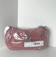Load image into Gallery viewer, A dusty rose leather shoulder bag inside clear plastic wrapping with a white product tag attached, set against a plain white background.