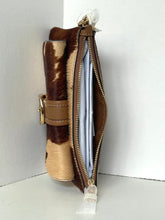 Load image into Gallery viewer, A brown and tan cowhide wallet with a gold-tone buckle and zipper, shown open to reveal white interior pages, set against a plain white background.