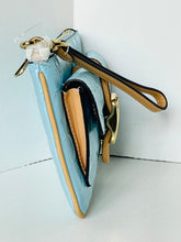 Load image into Gallery viewer, A light blue textured leather wristlet clutch with gold-tone hardware, a tan leather trim, and a matching wrist strap, shown standing upright against a white background.