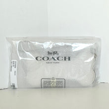 Load image into Gallery viewer, Coach New York pouch in clear packaging on a white background