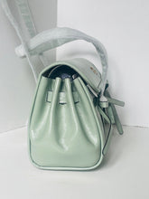 Load image into Gallery viewer, Mint green handbag with a strap on a white background